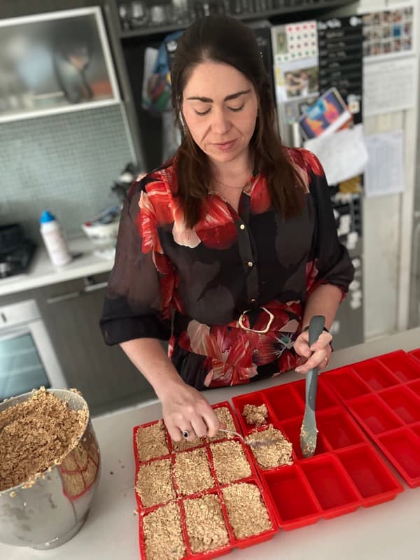 Laura preparing fresh dog meals in the Bonne Santé kitchen
